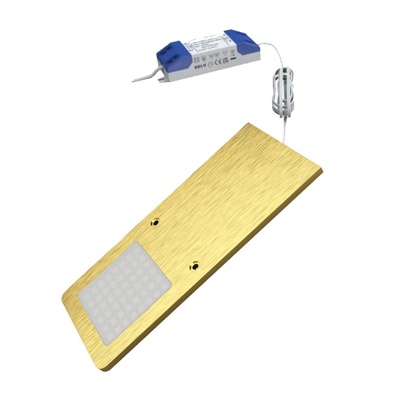 A single under cabinet light with a brushed brass finish connected to an LED driver.