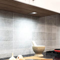 mid close up of a mounted LED cabinet light with cool white light