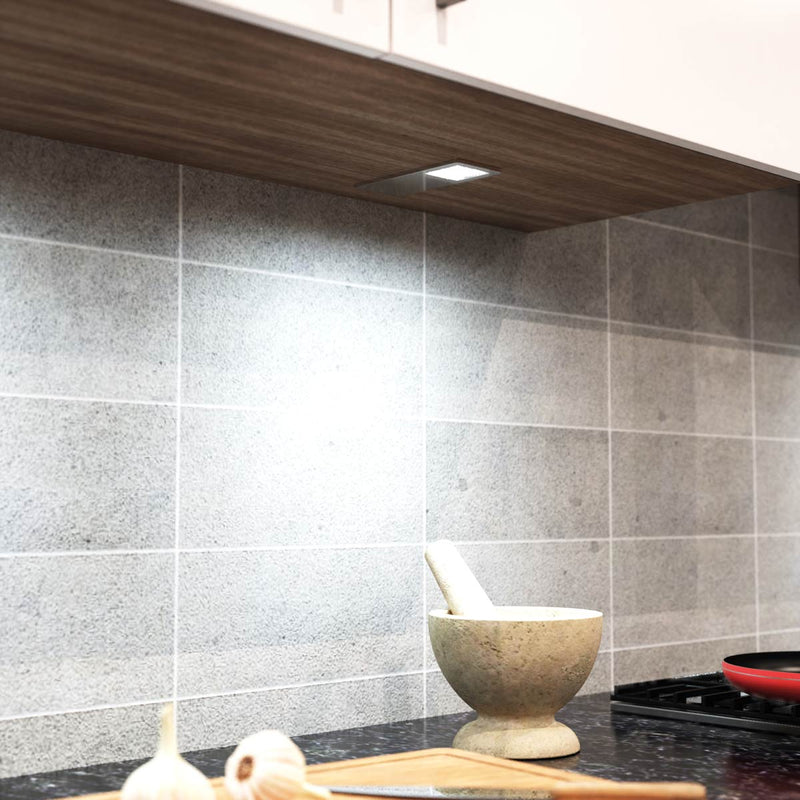 mid close up of a mounted LED cabinet light with cool white light