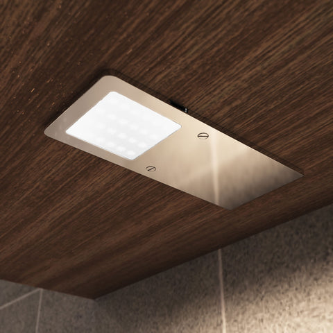 close up shot of a mounted LED cabinet light with natural white light