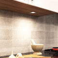 mid-shot of a mounted LED cabinet light with natural white light