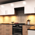 kitchen with mounted warm white cabinet lights