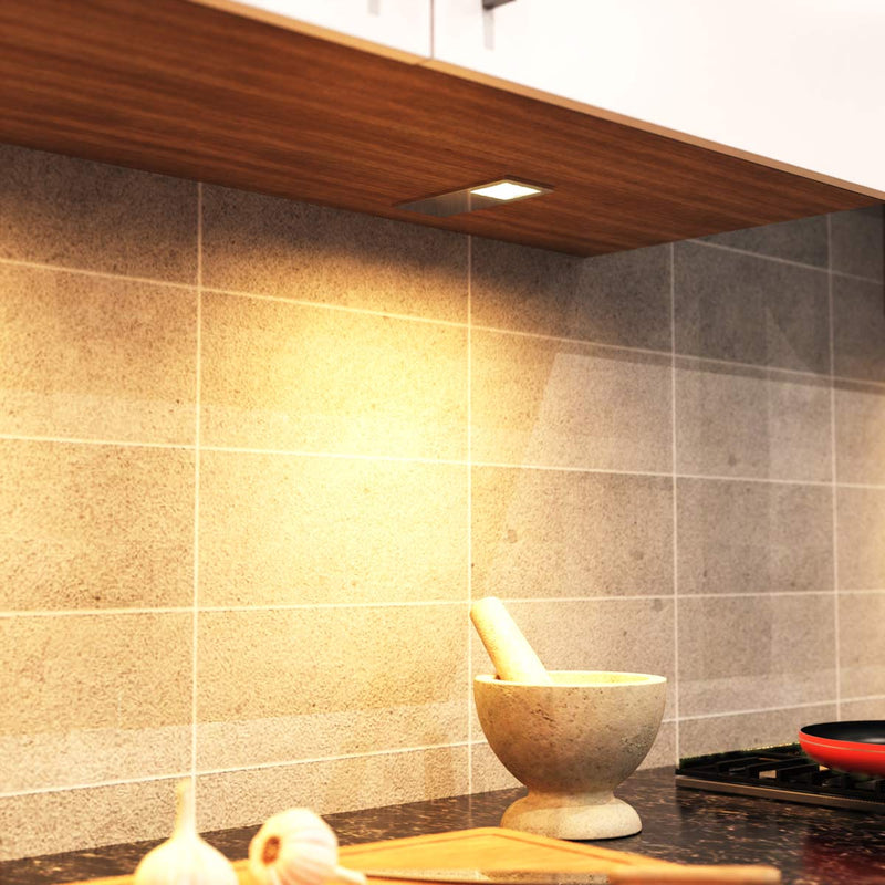 mid close up of a mounted LED cabinet light with warm white light