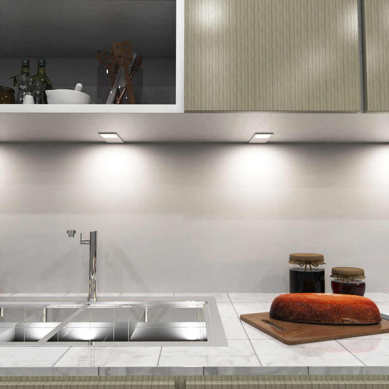 mid shot of a kitchen with mounted matte white LED CCT cabinet lights - natural white light