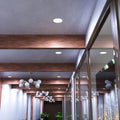 mid shot of a hallway ceiling with cool white LED panel lights