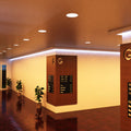 full shot of a corner hallway with warm white LED panel lights