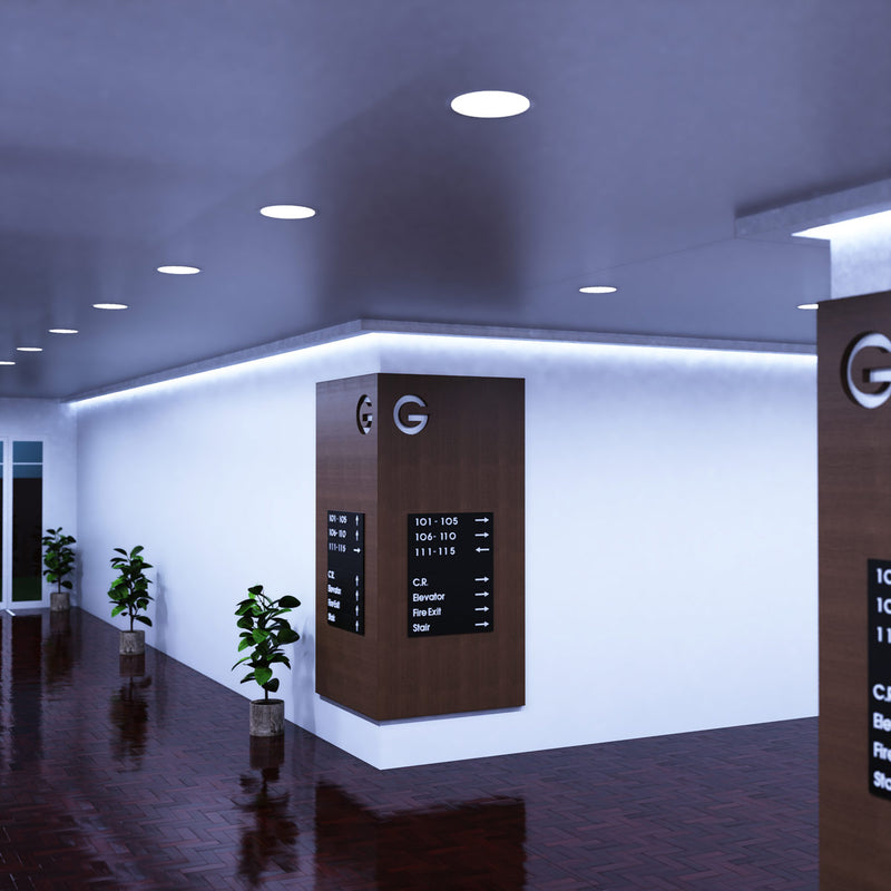 full shot of a corner hallway with cool white LED panel lights