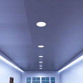 mid shot of a hallway ceiling with cool white LED panel lights