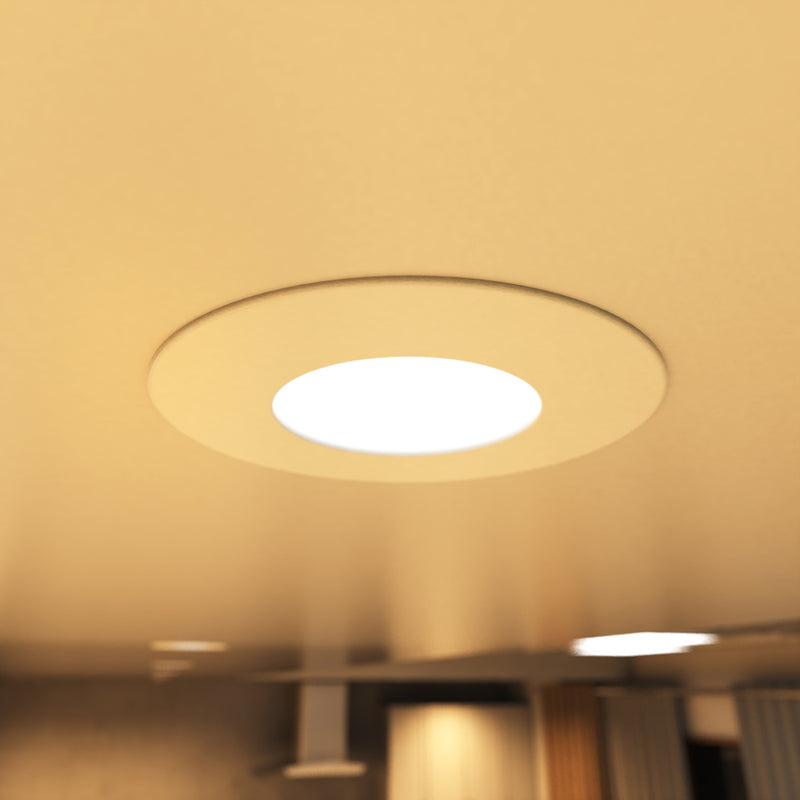 close up shot of a mounted white downlight in warm white light