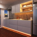 side view of a kitchen with warm white strip lights