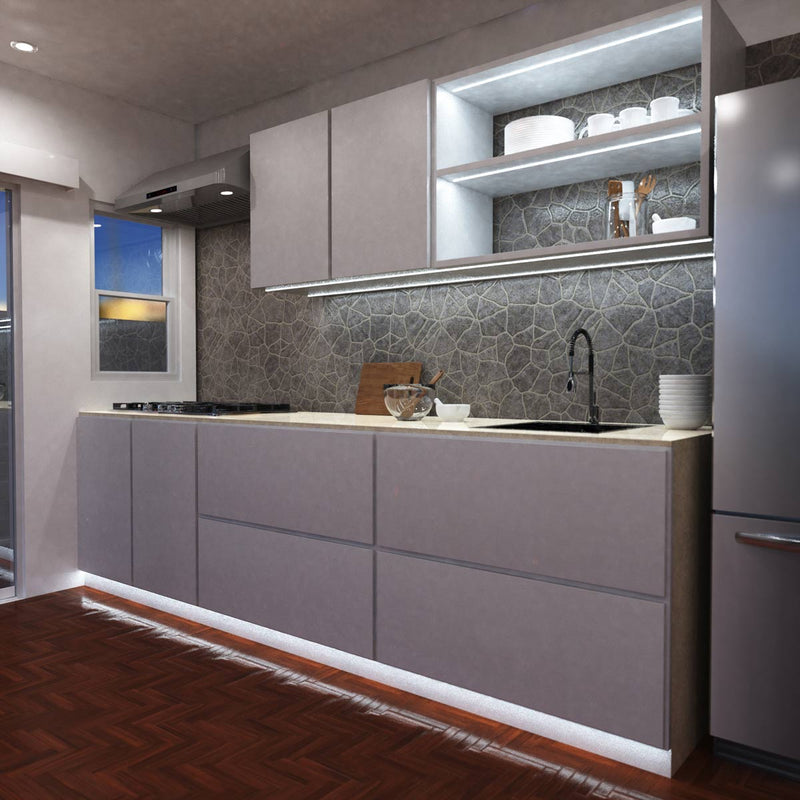 side view of a kitchen with cool white strip lights