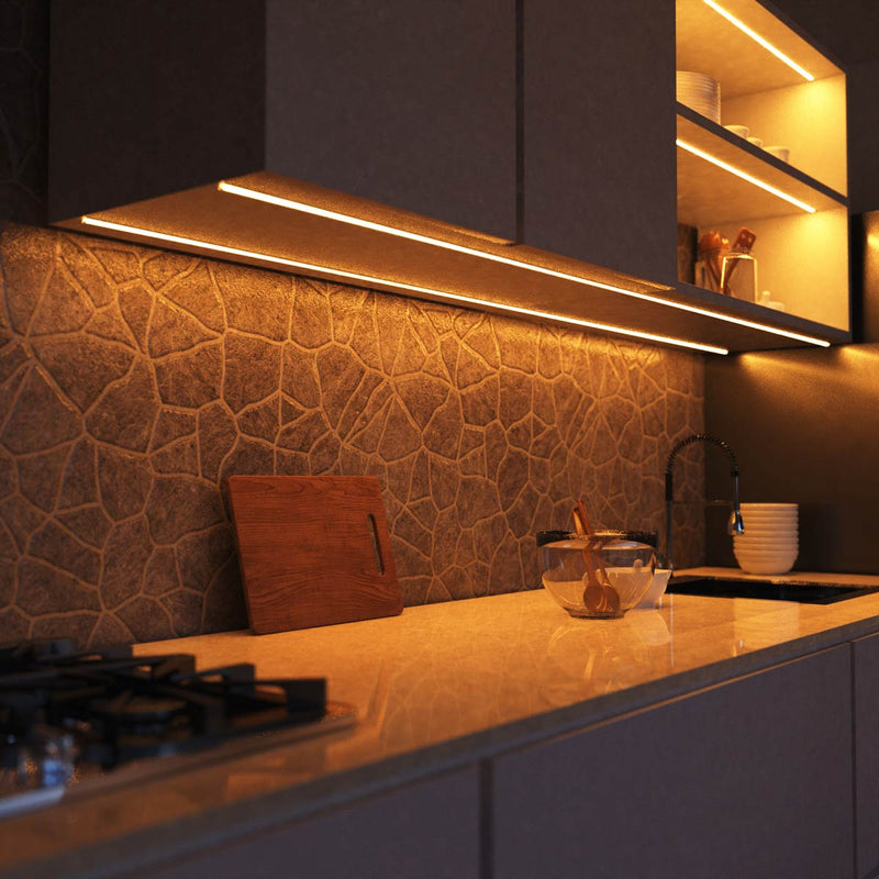 side close up of a kitchen with warm white strip lights