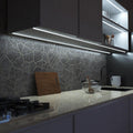 side close up of a kitchen with cool white strip lights