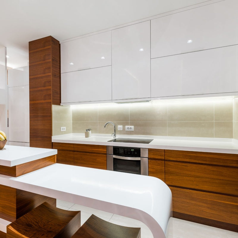 Side shot of a kitchen with an LED tape under the cabinets