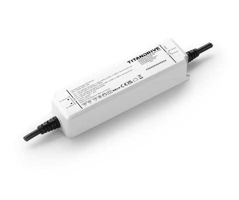 White rectangular LED driver with black input and output cables on white background
