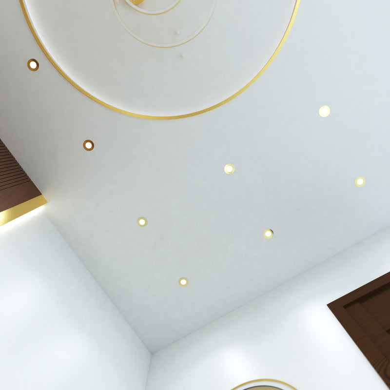 mid shot of a ceiling that has mounted brass LED downlights with cool white light