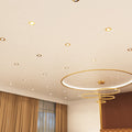 mid shot of a ceiling that has mounted brass LED downlights with natural white light