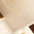 mid shot of a ceiling that has mounted brass LED downlights with natural white light