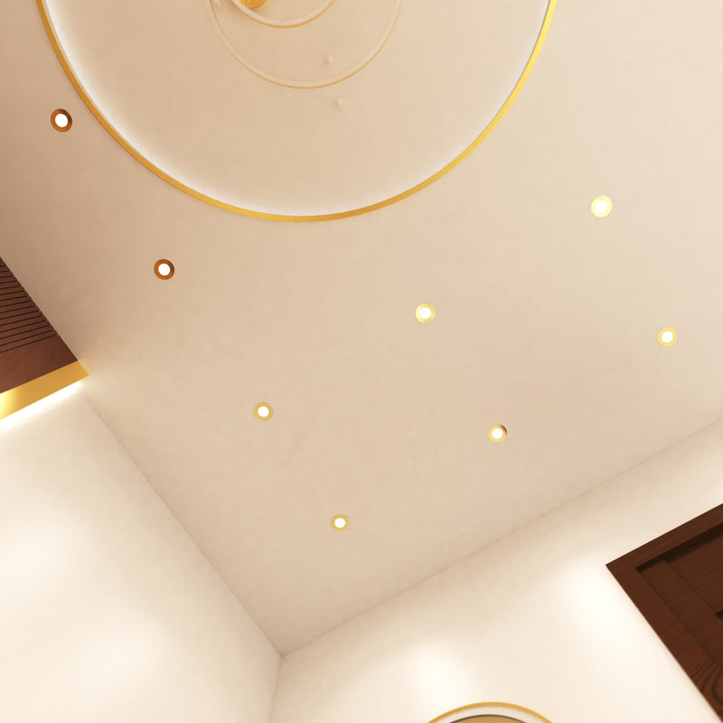 mid shot of a ceiling that has mounted brass LED downlights with natural white light