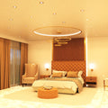full shot of a bedroom that has mounted brass LED downlights with warm white light