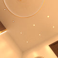 mid shot of a ceiling that has mounted brass LED downlights with warm white light