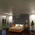 full shot of a bedroom with mounted natural white brushed chrome downlights