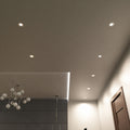 full shot of a ceiling with mounted natural white brushed chrome downlights
