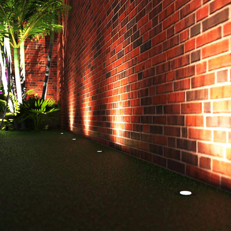 side of a garden with a walkway with ground lights