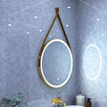 brushed titanium gold LED bathroom mirror in cool white light mounted above the sink side shot