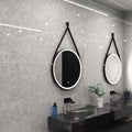 matte black LED bathroom mirror in natural white light mounted above the sinks