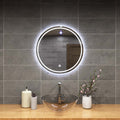 mid close up of a circular bathroom mirror with cool white light