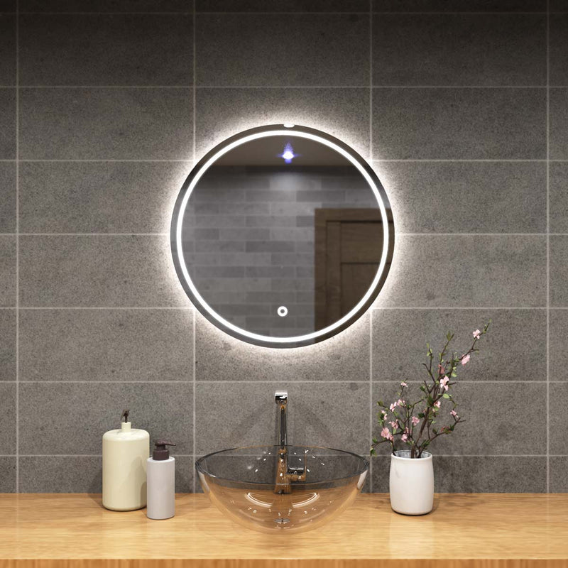 mid close up of a circular bathroom mirror with natural white light