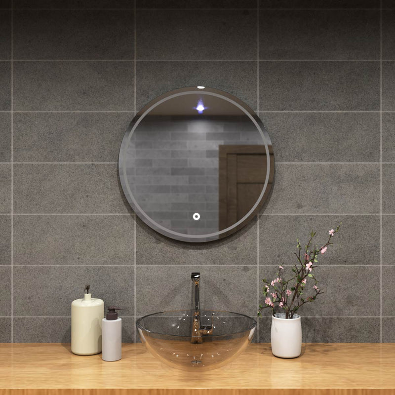 mid close up of a circular bathroom mirror