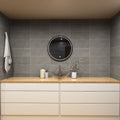 full shot of a vanity with a round LED bathroom mirror
