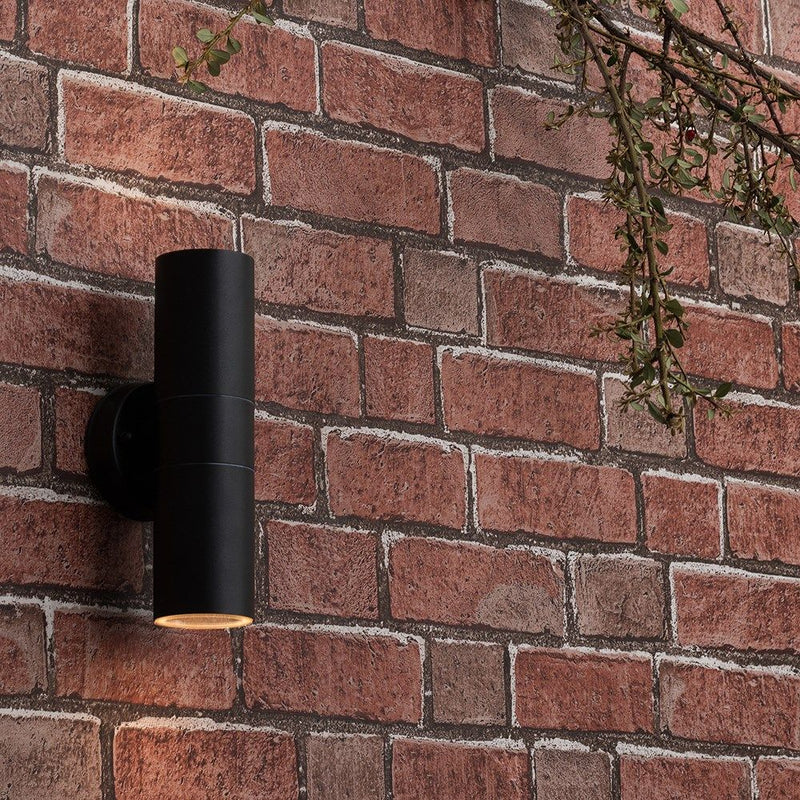 Close-up of Black Outdoor Up/Down Wall Light on a brick wall
