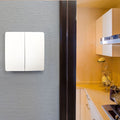 Side shot of a 2 gang kinetic switch on a wall