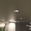 medium close up shot of a mounted natural white brushed chrome downlight