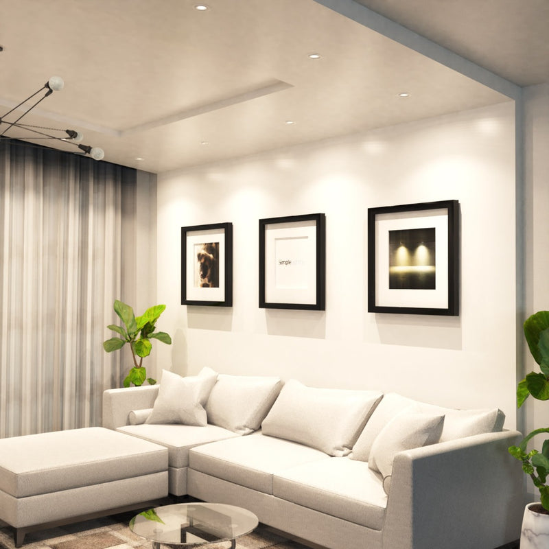 mid shot of a living room with white downlights in natural white light