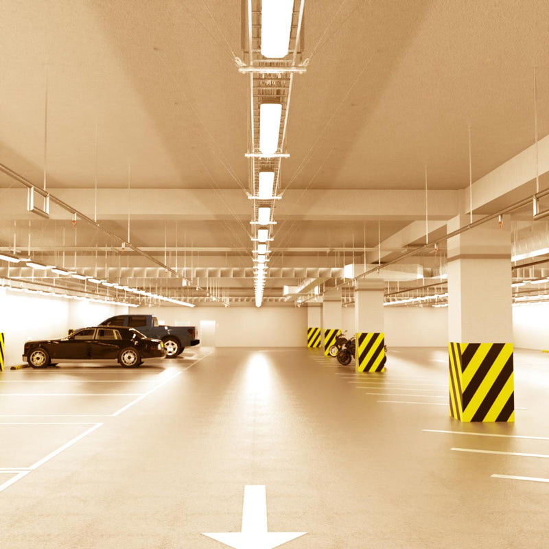 parking lot that has hanging LED battens with warm white light
