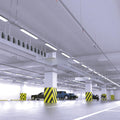 parking that has hanging LED battens with cool white light