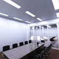 conference room that has surface mounted 1200x300 LED panels with cool white light