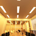 full shot of a conference room that has mounted LED panel lights with warm white light