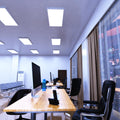 side shot of a workspace that has mounted 1200mm x 600mm  panel lights with cool white light