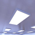ceiling that has surface mounted LED panel lights with cool white light