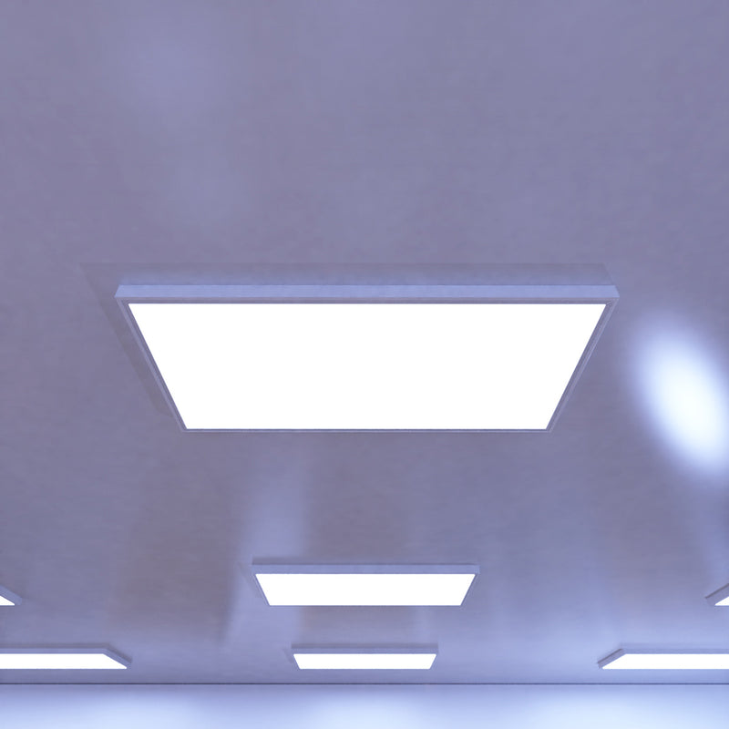 close up of a ceiling that has surface-mounted LED panels with cool white light