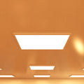 close up of a ceiling that has surface-mounted LED panels with warm white light