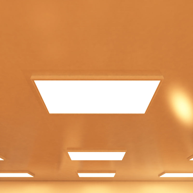 close up of a ceiling that has surface-mounted LED panels with warm white light