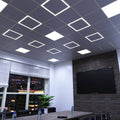 full shot of a ceiling with edge-lit LED panels in cool white light