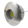 Close-up sideview of a round LED plinth light