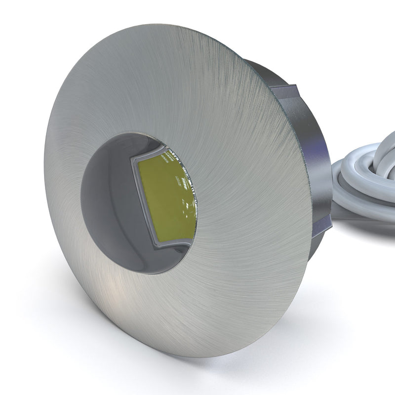 side close up of a round plinth light with brushed chrome finish